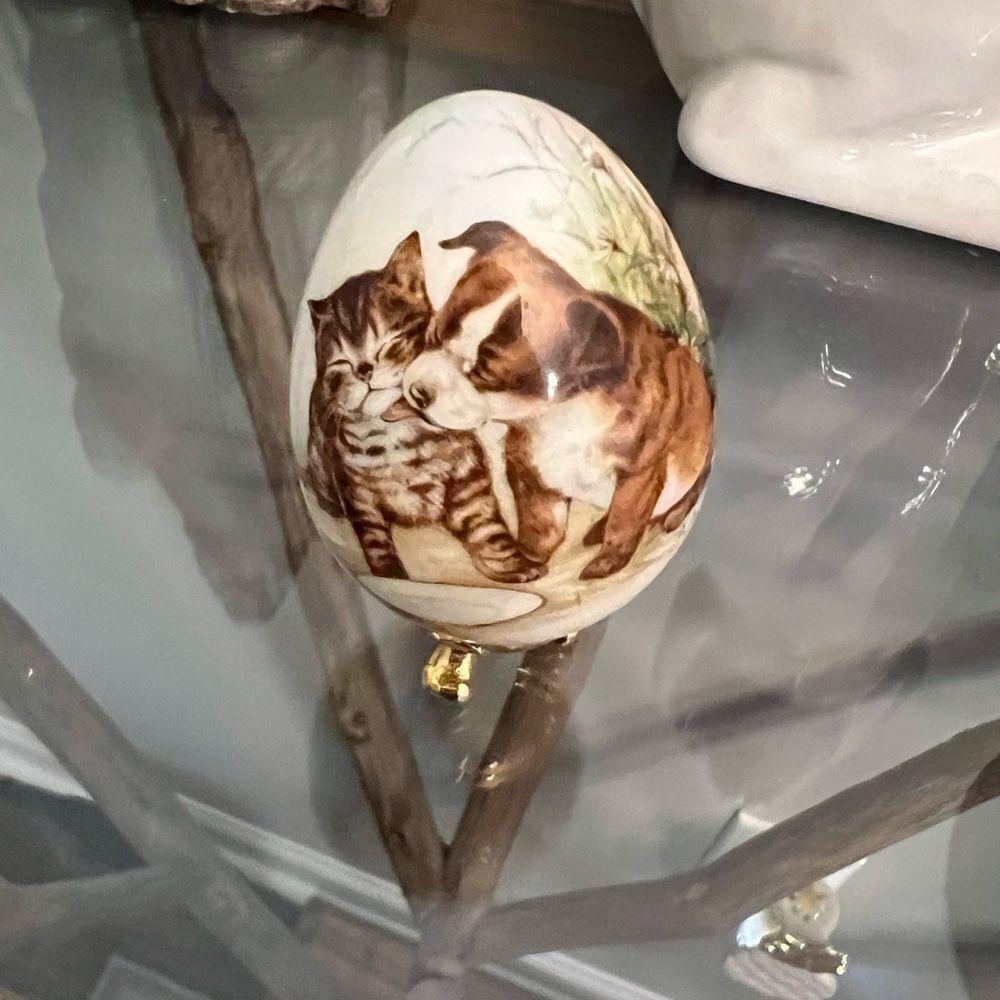 Decorative Egg with Puppy and Kitten Design w gold tone stand.